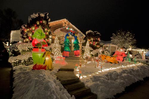 house decorated over the top with christmas lights