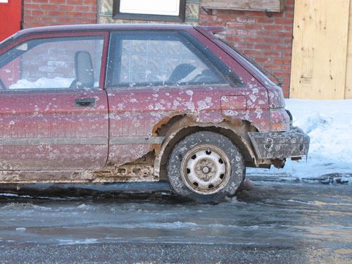 A Rusted Car due to all the salt used during winter A Rusted Car due to all the salt used during winter