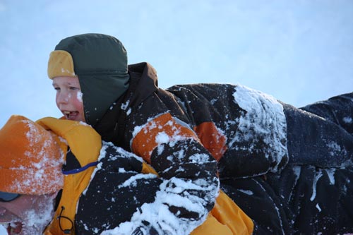 dad and son sledding