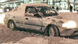 this driver hasn't bothered to clear the snow off car before hitting the road 